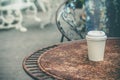 Close up paper cup on the rusty table Royalty Free Stock Photo