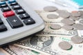 Close up on paper currency, coins and calculator. Selective focus Royalty Free Stock Photo