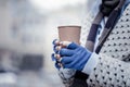 Close up of a paper glass in female hands Royalty Free Stock Photo