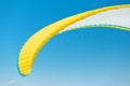 Close-up of paraglider wing and blue sky in the background. Concept of active recreation and equipment for air sports and