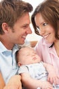 Close Up Of Parents Cuddling Newborn Baby Boy At H Royalty Free Stock Photo