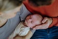 Close-up of parents cuddling their newborn baby. Royalty Free Stock Photo