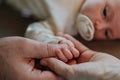 Close-up of parents cuddling their newborn baby. Royalty Free Stock Photo