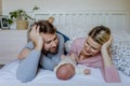 Close-up of parents cuddling their newborn baby. Royalty Free Stock Photo