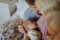 Close-up of parents cuddling their newborn baby. Royalty Free Stock Photo