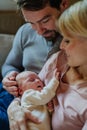 Close-up of parents cuddling their newborn baby. Royalty Free Stock Photo