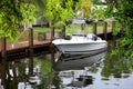 parked boat at dock on canal in Florida, USA Royalty Free Stock Photo