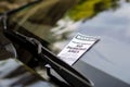 Close-up of parking ticket on car`s windshield Royalty Free Stock Photo