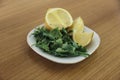 Close up of parsley leafs and juicy lemons Royalty Free Stock Photo