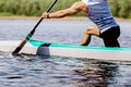 close-up part body male canoeist on canoe single rowing training on lake