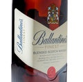 Close-up of a part of a bottle of Ballantine's whiskey on a white background. Ballantine's whiskey is one of the top