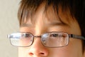 Close-up of part of child`s face, boy 10-12 years old in glasses, stress problems, difficult childhood, victim of domestic
