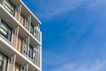 Close up part of condominium modern style on blue sky background Royalty Free Stock Photo