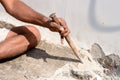Close up Part of a construction labor working with hammer and Chisel in a construction site Royalty Free Stock Photo