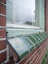 Close up of part of a dilapidated and neglected wooden window frame