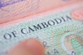 close-up part of page of document, foreign passport for travel with Cambodia visa, tourist visa stamp with hologram with shallow Royalty Free Stock Photo