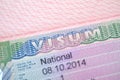 close-up part of page of document, foreign passport for travel with European visa, national visa stamp with shallow depth of field Royalty Free Stock Photo