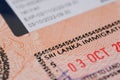close-up part of page of document, foreign passport for travel with Sri Lanka visa, tourist visa stamp with hologram with shallow Royalty Free Stock Photo