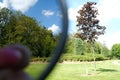 Close up of a part of a polarizer filter, show the difference with and without this filter, landscape background Royalty Free Stock Photo