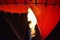 Close-up of a part of red hot air balloon burner flame glowing Royalty Free Stock Photo