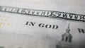 Close-up of part of slogan In God We Trust in the US banknote. Business and finance concept. Macro photography, selective focus Royalty Free Stock Photo