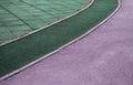 Close-up of a part of a sports stadium with markings for a treadmill, green-purple tinting Royalty Free Stock Photo