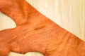 Close up part of tan leather lay down on wood table Royalty Free Stock Photo