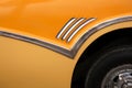 Close up of part of a yellow 1950`s classic car, in Havana, Cuba Royalty Free Stock Photo