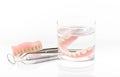 Close up of partial dentures and dental tool,dental mirror on white background Royalty Free Stock Photo