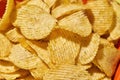 Close up partial of tasty potato chips in bowl