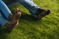 close-up partial view of barefoot african american couple in pajamas spending time together