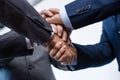 Close-up partial view of businesspeople in formal wear stacking hands together Royalty Free Stock Photo