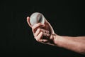 close-up partial view of male hand holding baseball ball Royalty Free Stock Photo