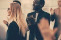 Close up. participants of the international business seminar give a standing ovation Royalty Free Stock Photo