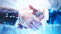 Close up of partners shaking hands, digital charts Royalty Free Stock Photo