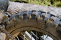 Close-up of parts of motocross bike. Tyre wheel close-up