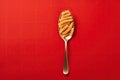 Close up of pasta isolated on red background in spoon or fork Royalty Free Stock Photo