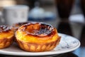 Close up of Pastel de Nata or pastel de BelÃÂ©m, a Portuguese egg custard tart pastry