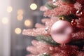 AI generated. Close up of pastel pink Christmas tree toy ball decoration on a fluffy fir branch