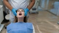 Close-up of a patient at the dentist being checked. She opened her mouth wide. Royalty Free Stock Photo