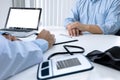 Close up of patient and doctor taking notes in a hospital or clinic Royalty Free Stock Photo