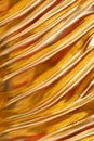 Close up pattern of The Buddha statue in temple at thailand gold color isolated on black background Royalty Free Stock Photo