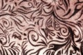 Close-up pattern of fleece fabric with leopard pattern. Brown-beige and black striped repeating on the surface of fur clothes, Royalty Free Stock Photo