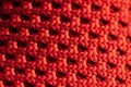 A close-up pattern of a woven red fabric