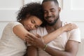 Happy African American couple cuddle hugging at home Royalty Free Stock Photo