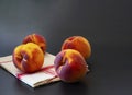 Close up of peaches on a table. Royalty Free Stock Photo