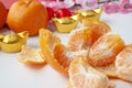 Top view of Pealed Mandarin oranges on white cover background. Chinese New Year red celebratio