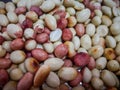 A close up Of peanuts with the reddish cover