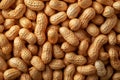 Close-up of peanuts in shell creating a textured background, ideal for food-related projects Royalty Free Stock Photo