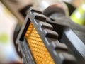 Close-up of a pedal from a bicycle with a reflector. Bicycle parts. Royalty Free Stock Photo